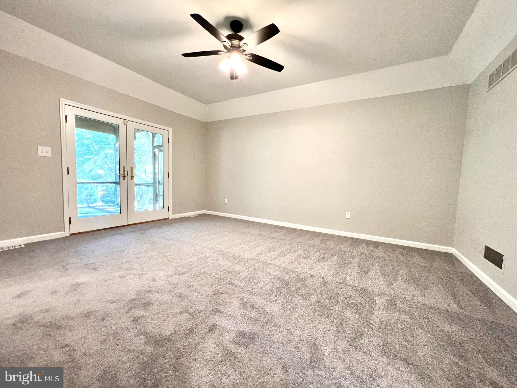 1 Cutter Way Middletown, DE 19709 - Photo 5 of 41 an empty room with windows and ceiling fan