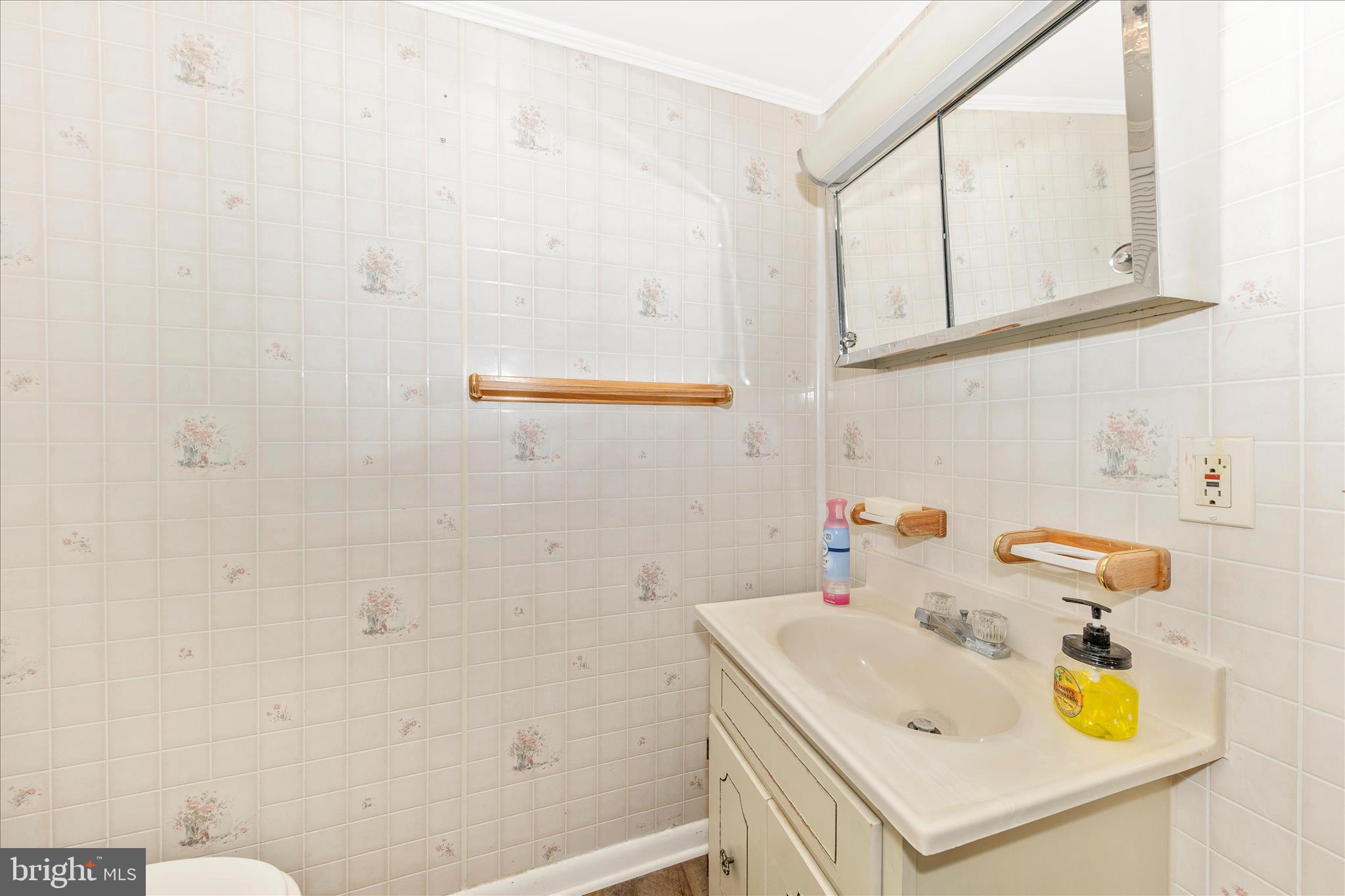 108 South Main Street Boonsboro, MD 21713 - Photo 16 of 50 a bathroom with a sink a vanity and a mirror