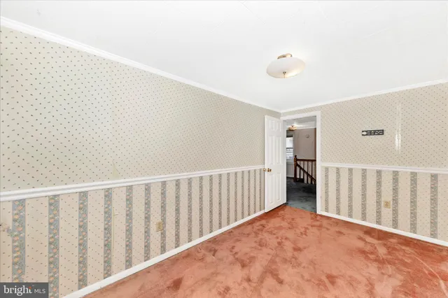 a view of empty room with windows