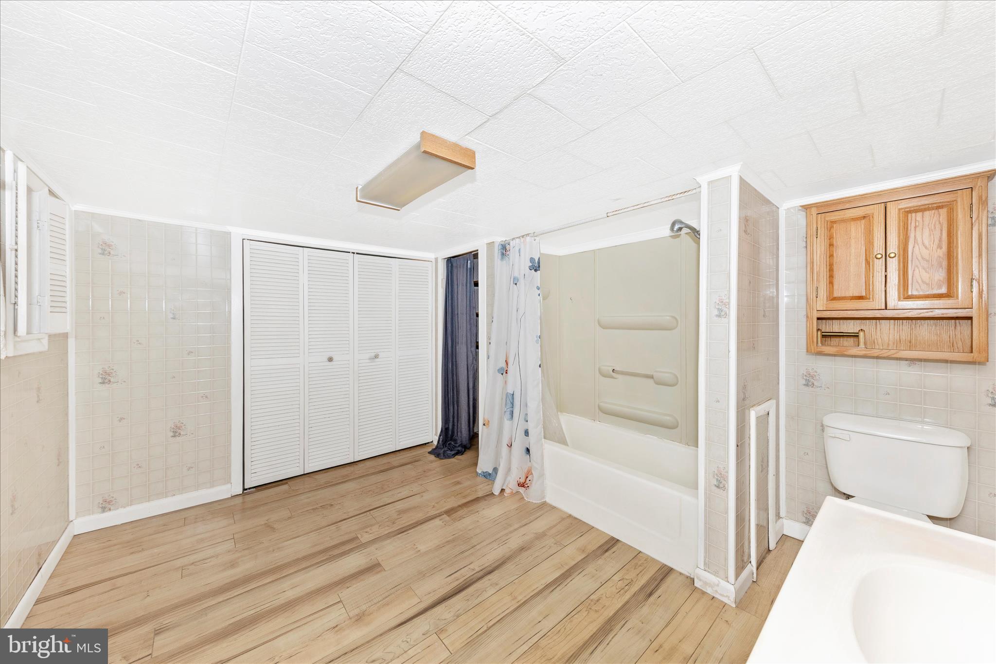 108 South Main Street Boonsboro, MD 21713 - Photo 31 of 50 a bathroom with a shower and a toilet