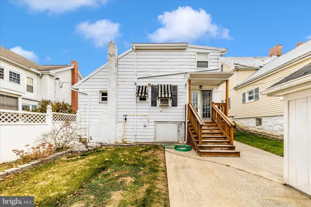 a view of a swimming pool with an outdoor space and seating area