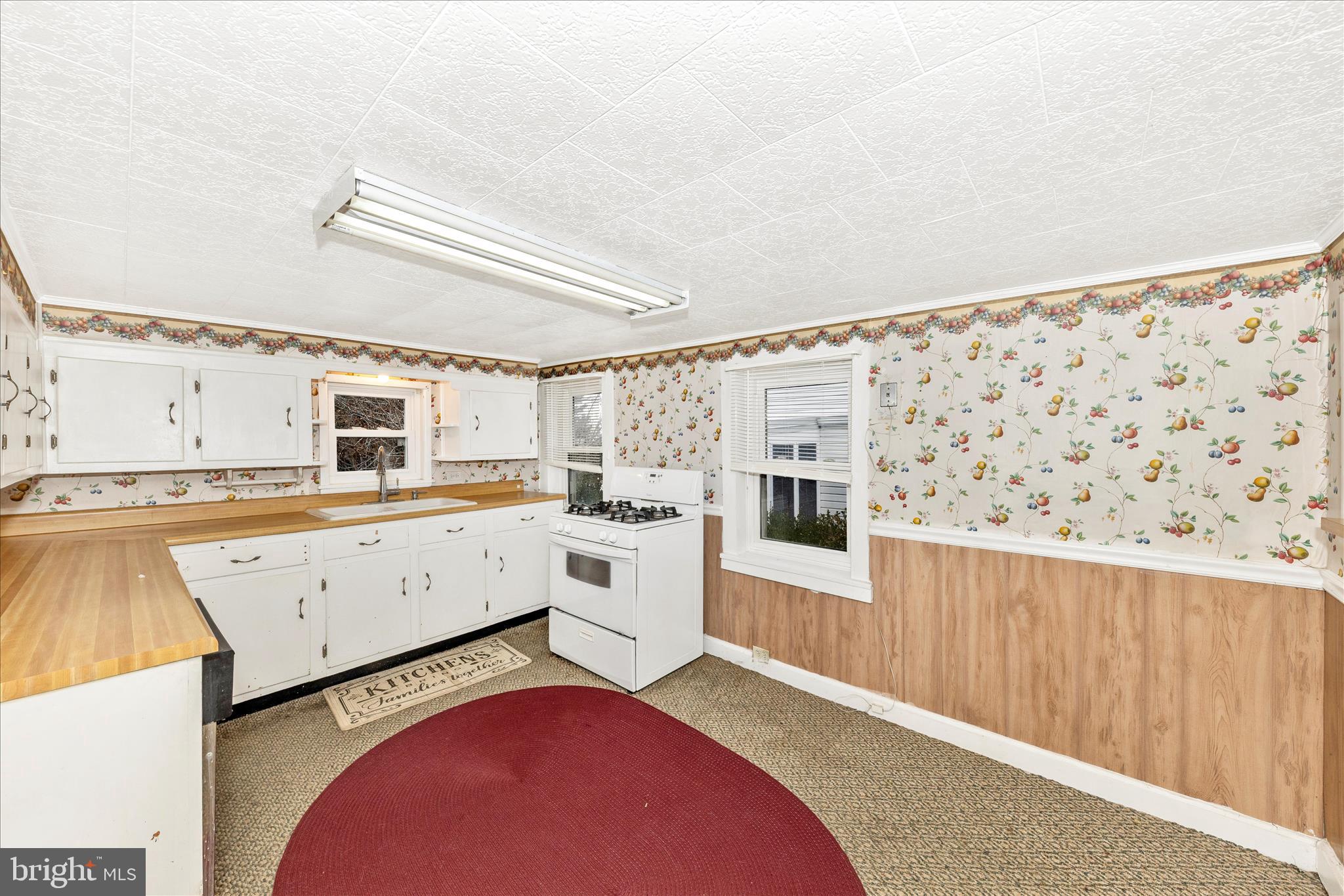 108 South Main Street Boonsboro, MD 21713 - Photo 9 of 50 a view of a kitchen with furniture and wooden floor