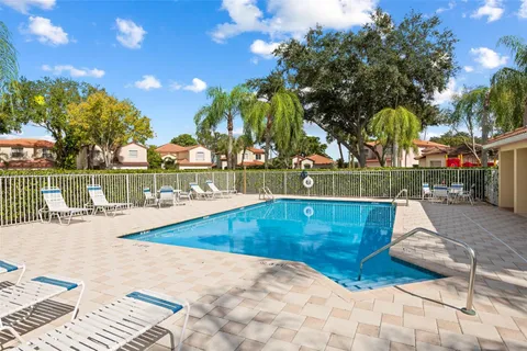 a view of a swimming pool with a lounge chairs