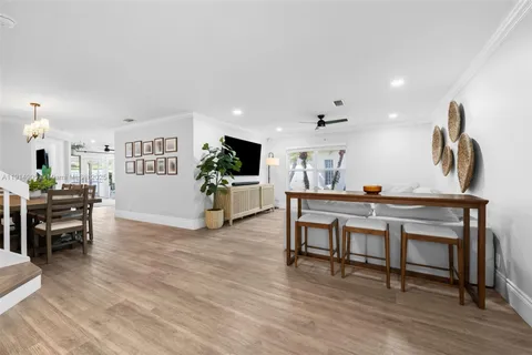 a view of kitchen with furniture and wooden floor