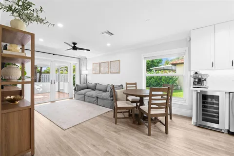 a living room with furniture a fireplace and a table