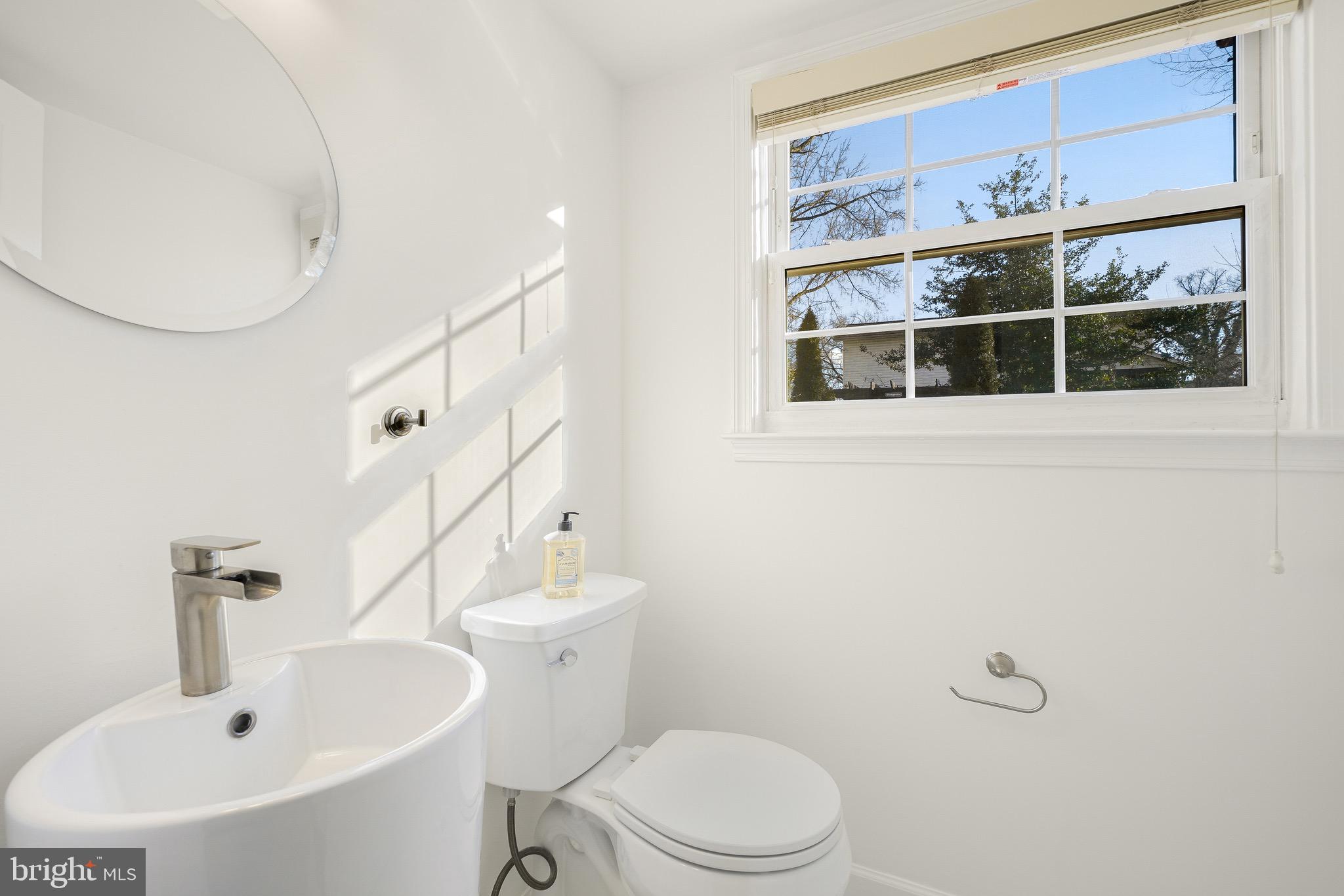 4712 Listra Road Rockville, MD 20853 - Photo 12 of 30 a bathroom with a sink a toilet and shower