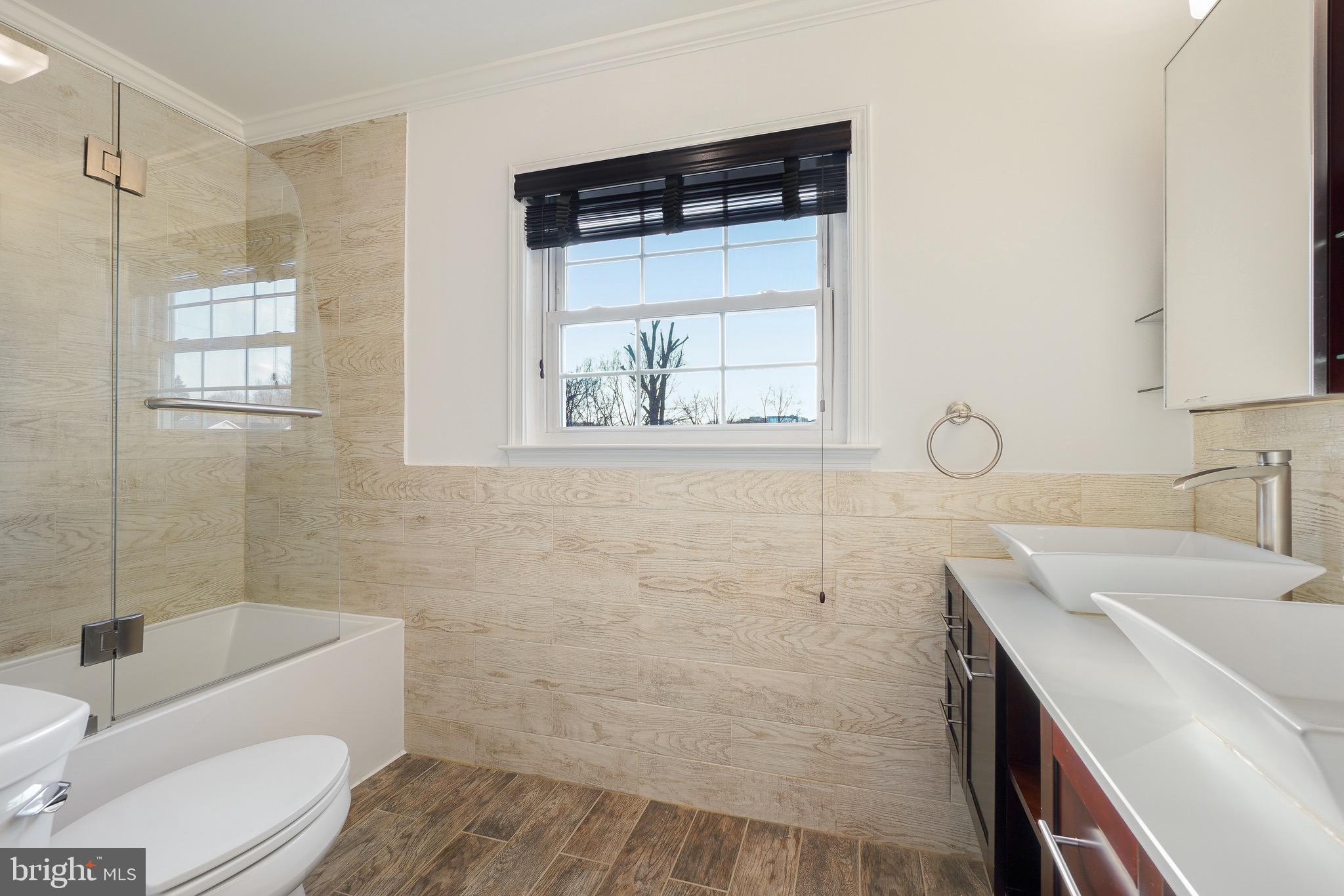 4712 Listra Road Rockville, MD 20853 - Photo 15 of 30 a bathroom with a sink toilet and shower