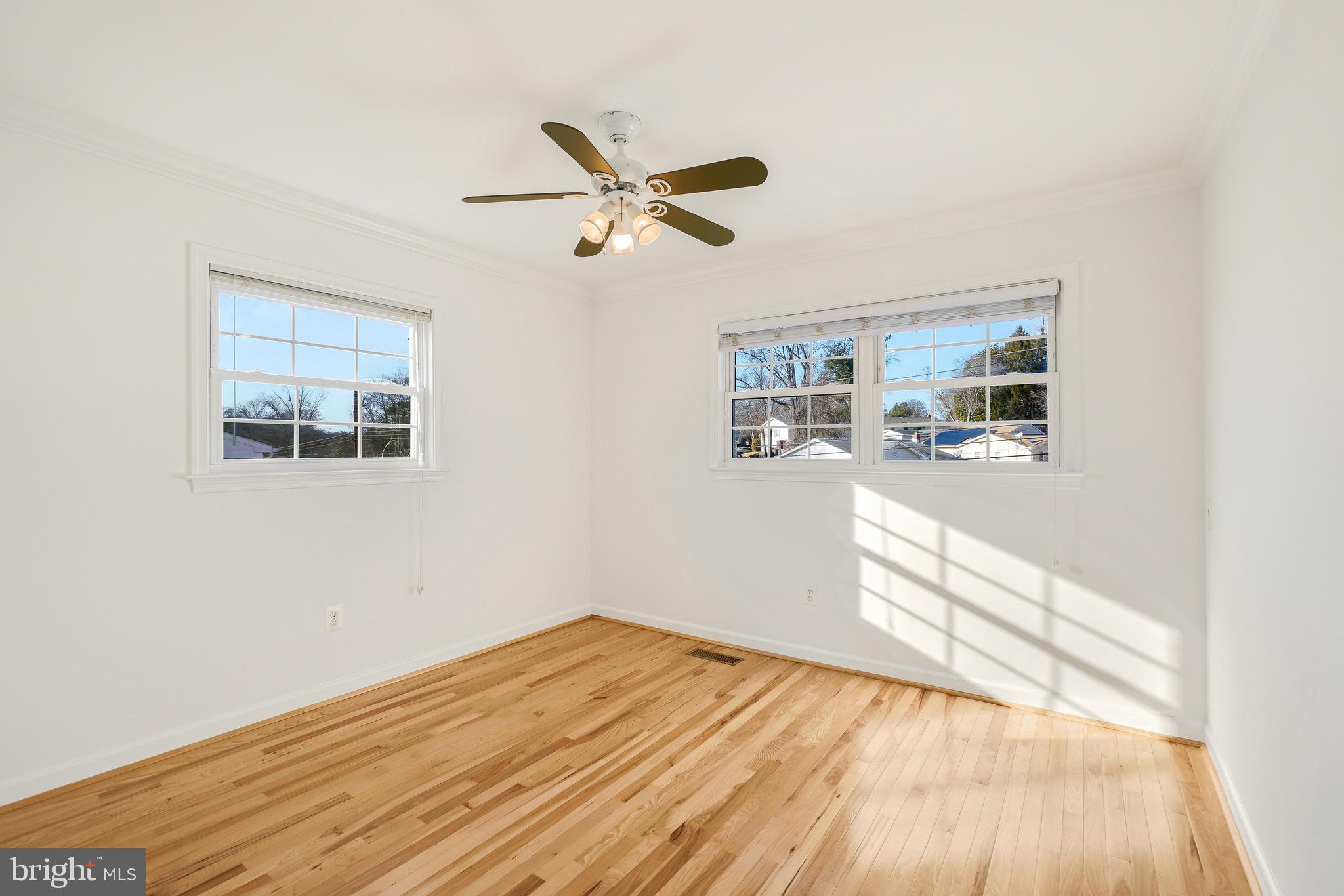 4712 Listra Road Rockville, MD 20853 - Photo 16 of 30 a view of empty room with wooden floor and fan
