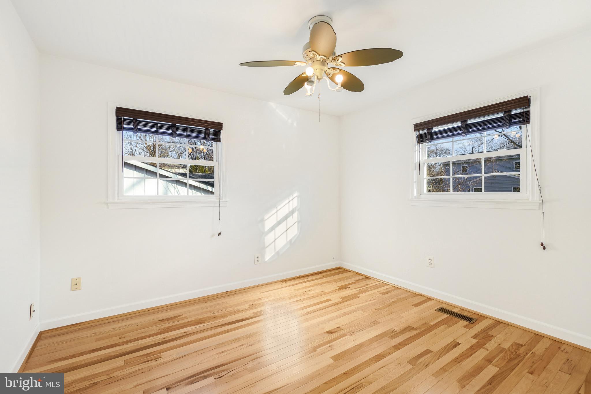 4712 Listra Road Rockville, MD 20853 - Photo 19 of 30 a view of a room with wooden floor and ceiling fan