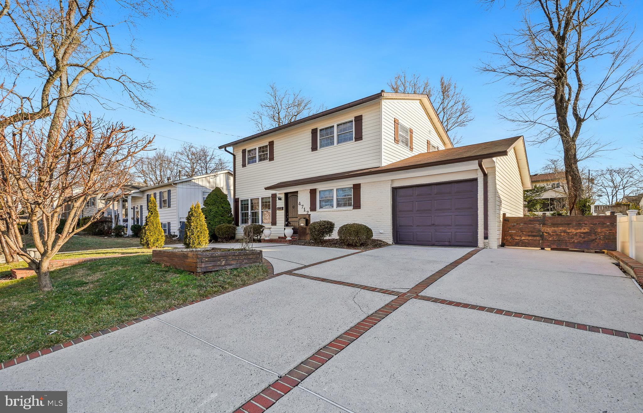 4712 Listra Road Rockville, MD 20853 - Photo 2 of 30 a front view of a house with a yard and garage