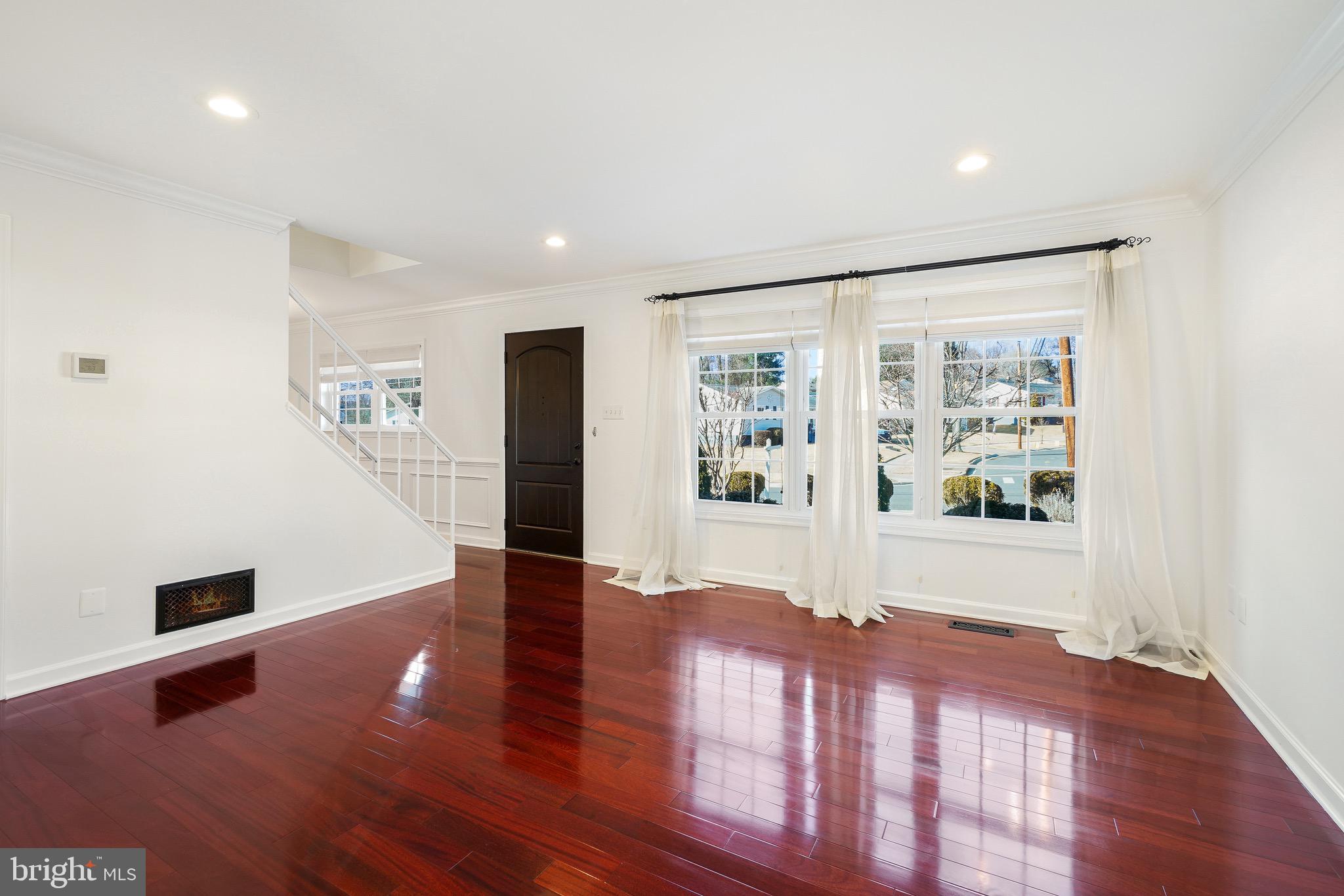 4712 Listra Road Rockville, MD 20853 - Photo 4 of 30 a view of a big room with wooden floor and windows