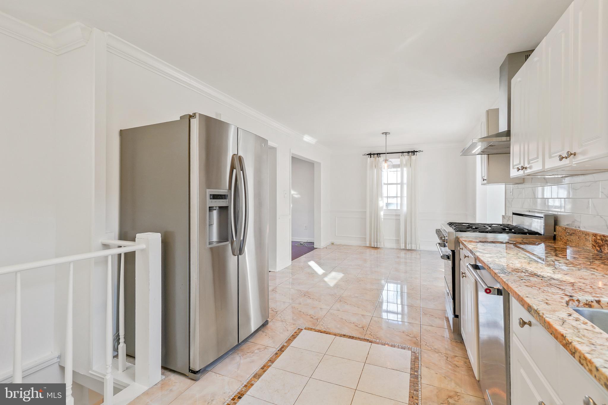 4712 Listra Road Rockville, MD 20853 - Photo 10 of 30 a kitchen with stainless steel appliances granite countertop a refrigerator and a stove