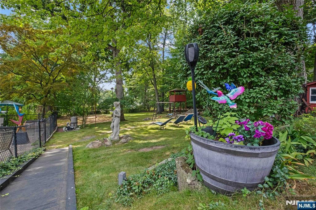 1468 Alps Road Wayne, NJ 07470 - Photo 23 of 36 a view of a garden with flowers and trees