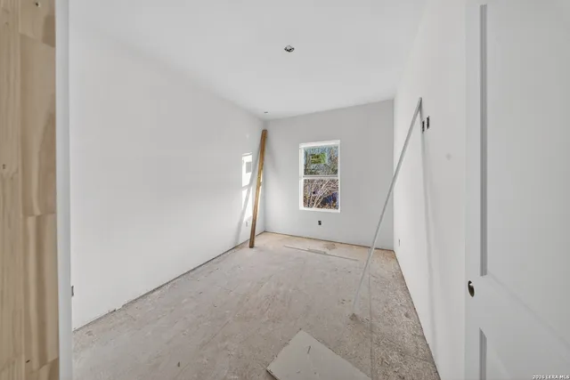 a bathroom with a tub sink and shower