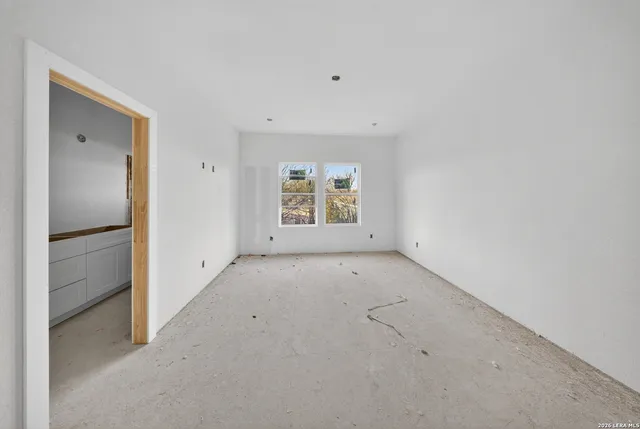 a view of hallway with wooden floor