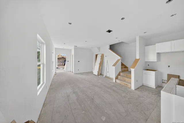 a view of a livingroom with stairs