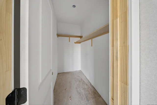 a view of a hallway with closet area