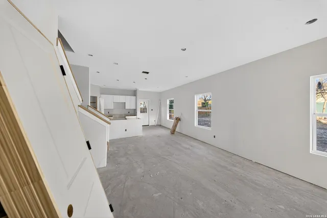 a view of a kitchen with entryway and stairs