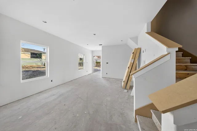 a view of an empty room with stairs