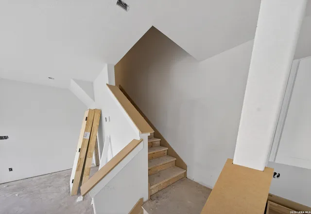 a view of a livingroom with wooden floor