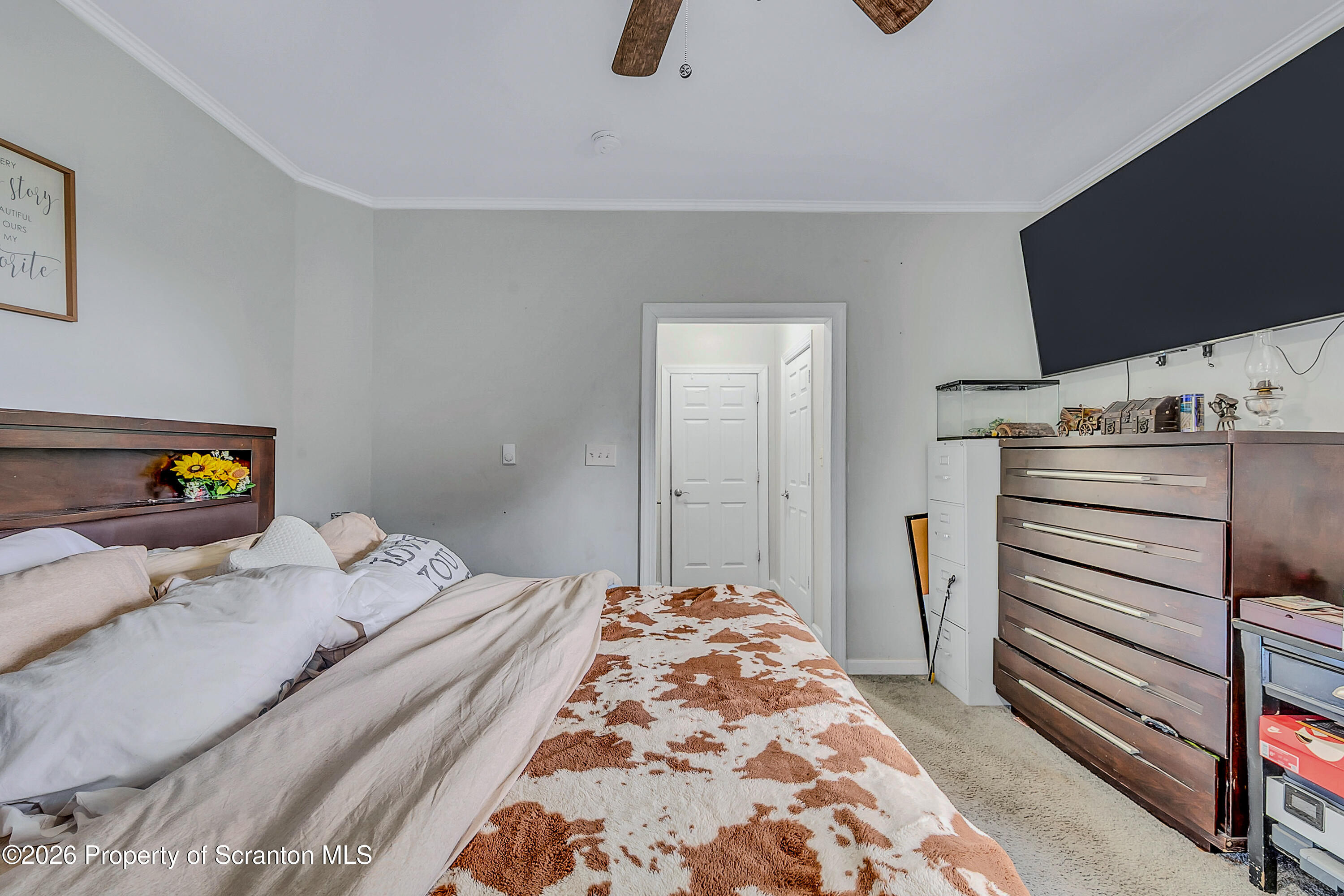 29 Rittenhouse Street Simpson, PA 18407 - Photo 14 of 36 a bedroom with a bed and a flat screen tv