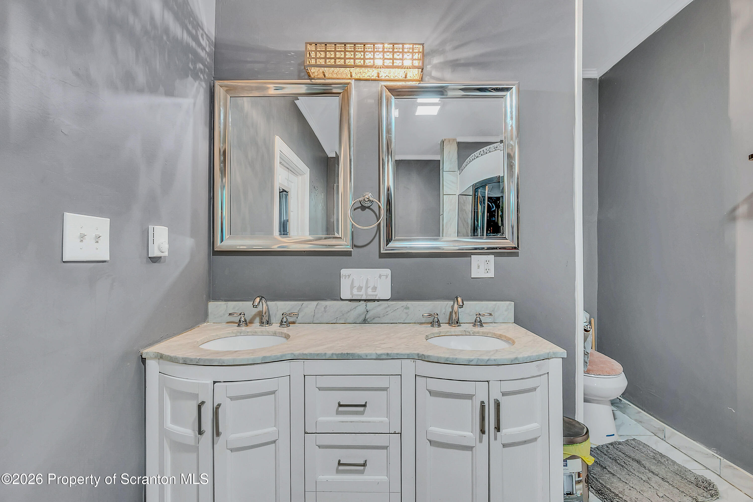 29 Rittenhouse Street Simpson, PA 18407 - Photo 17 of 36 a bathroom with a sink and a mirror