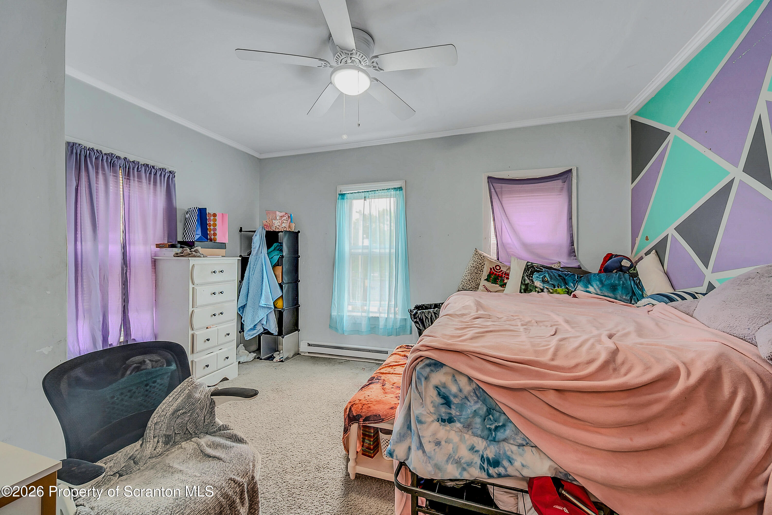 29 Rittenhouse Street Simpson, PA 18407 - Photo 29 of 36 a bedroom with bed and a chair