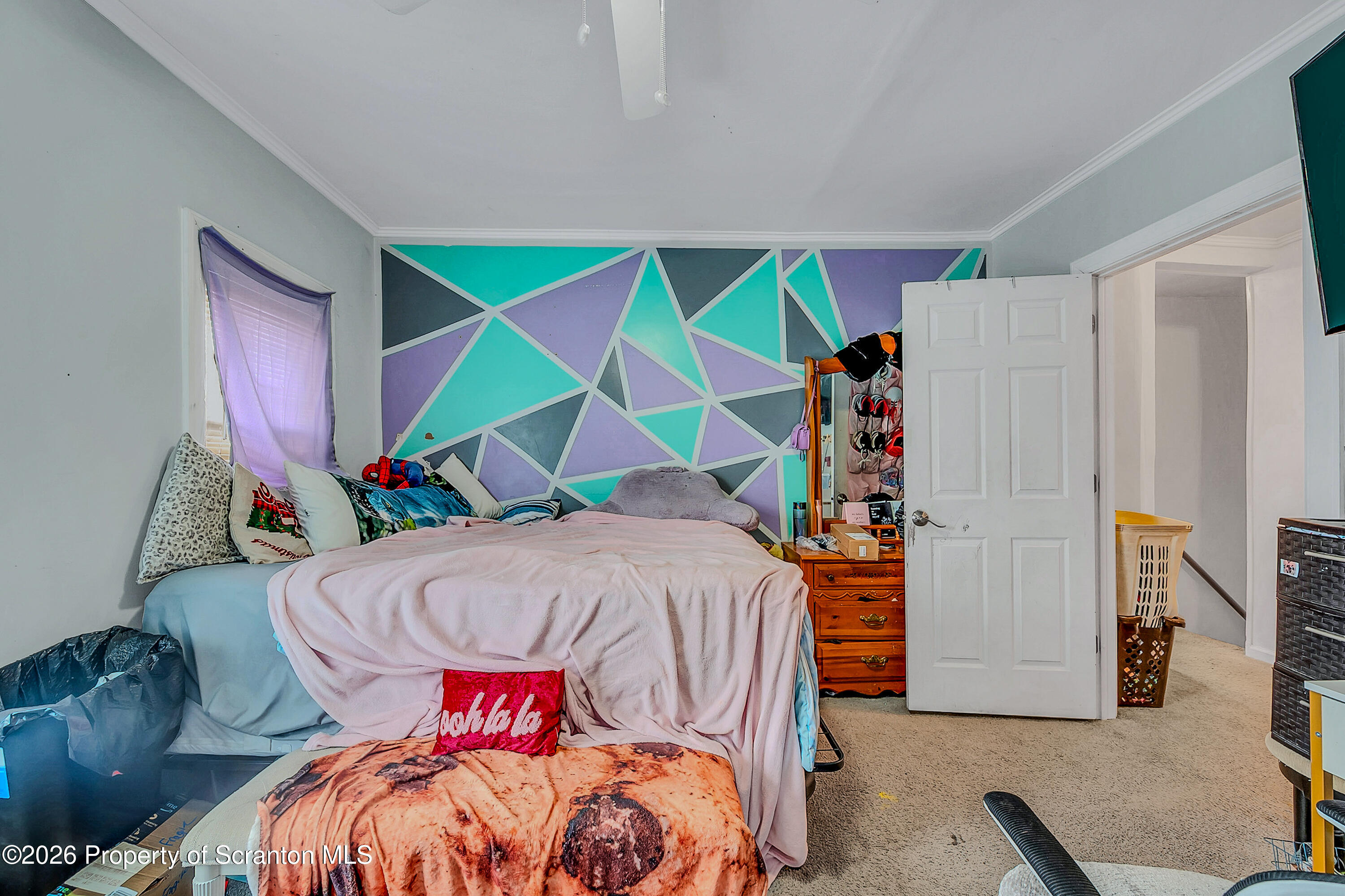 29 Rittenhouse Street Simpson, PA 18407 - Photo 30 of 36 a bed room with a bed and a couch