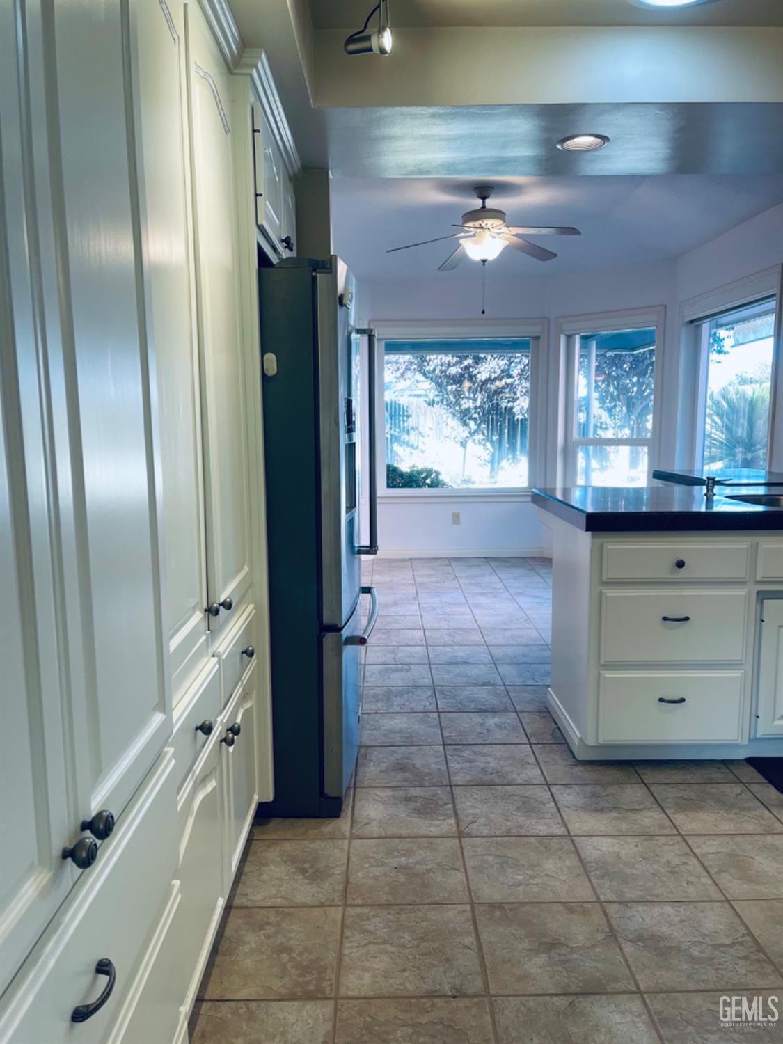 Undisclosed Address Shafter, CA 93263 - Photo 11 of 41 a kitchen with a refrigerator and window