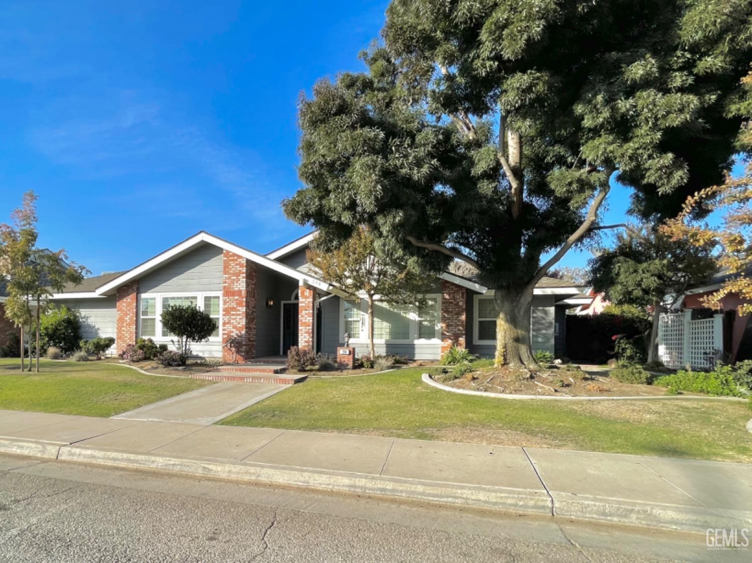 Undisclosed Address Shafter, CA 93263 - Photo 2 of 41 a front view of a building with a yard