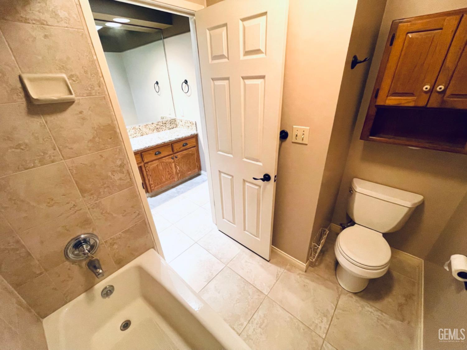 Undisclosed Address Shafter, CA 93263 - Photo 24 of 41 a bathroom with a tub and toilet