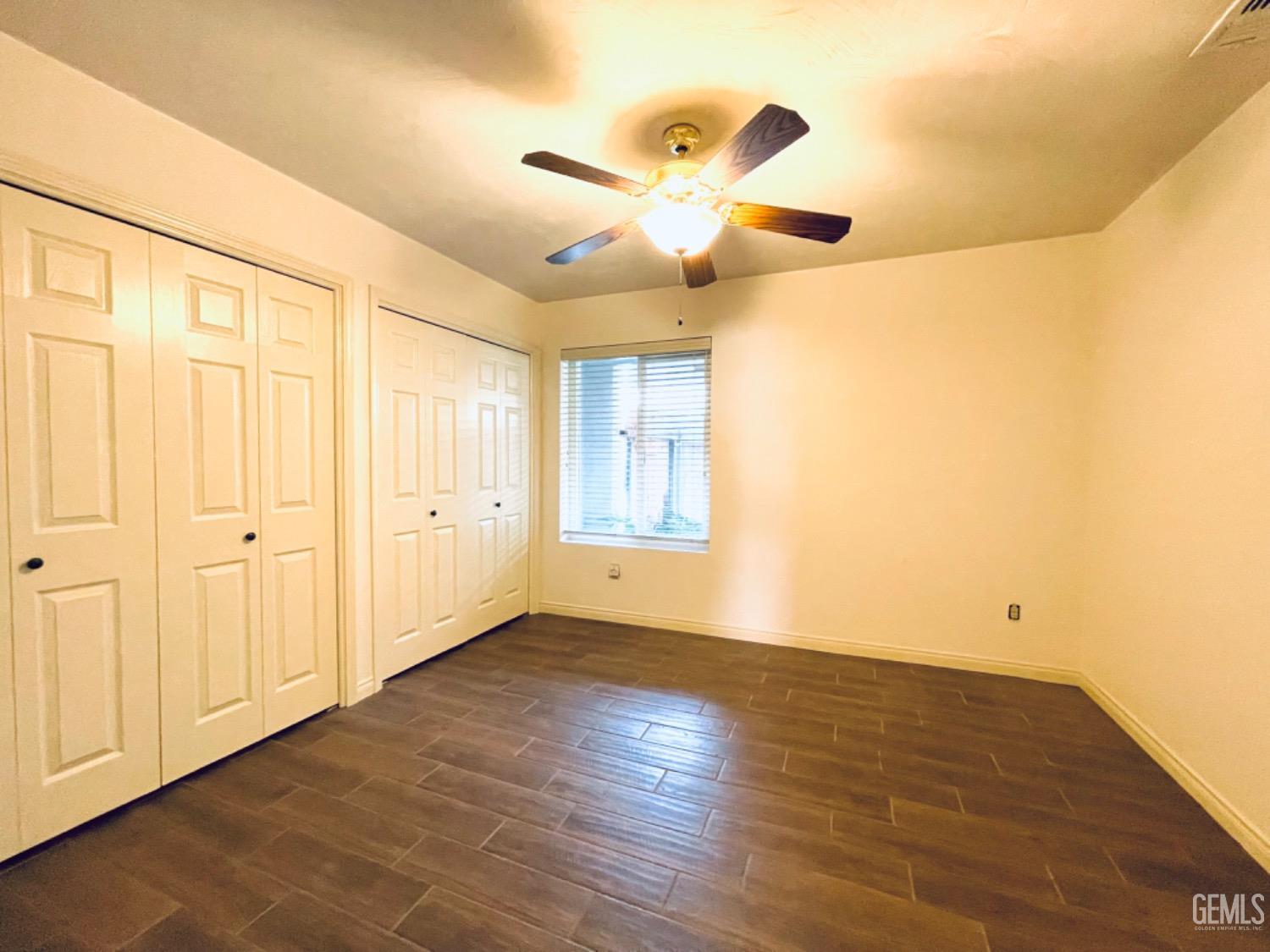 Undisclosed Address Shafter, CA 93263 - Photo 25 of 41 a view of an empty room with wooden floor