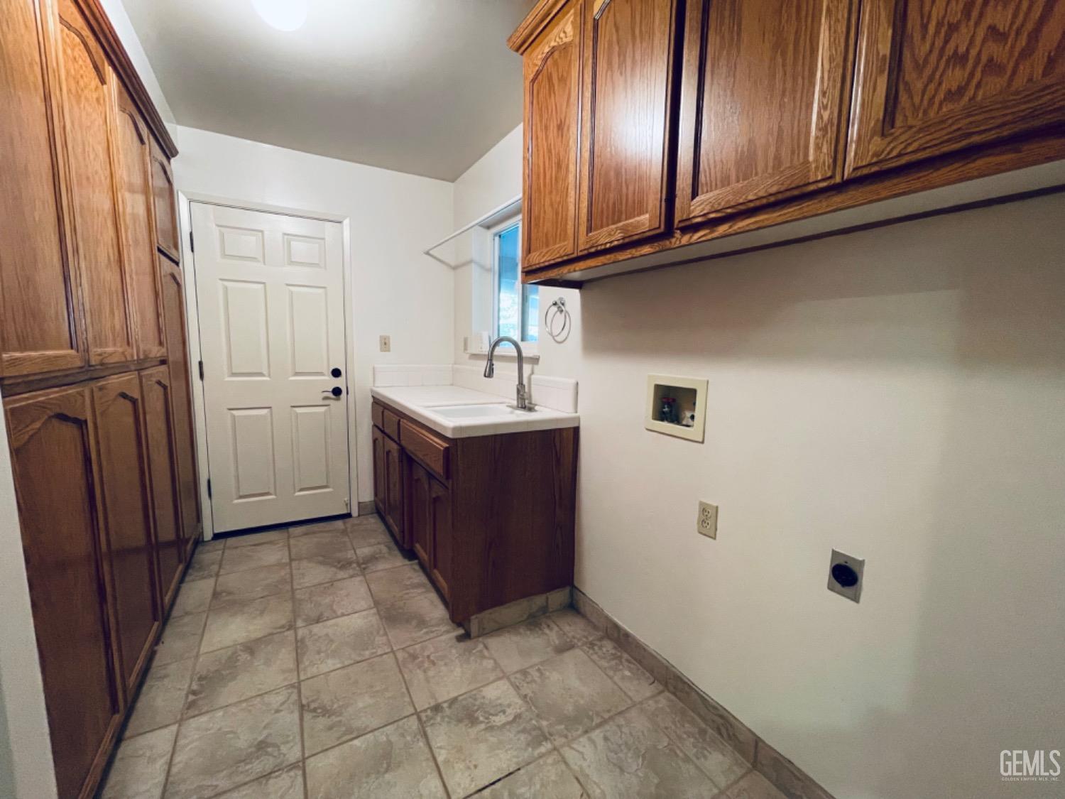 Undisclosed Address Shafter, CA 93263 - Photo 29 of 41 a kitchen with cabinets and stainless steel appliances