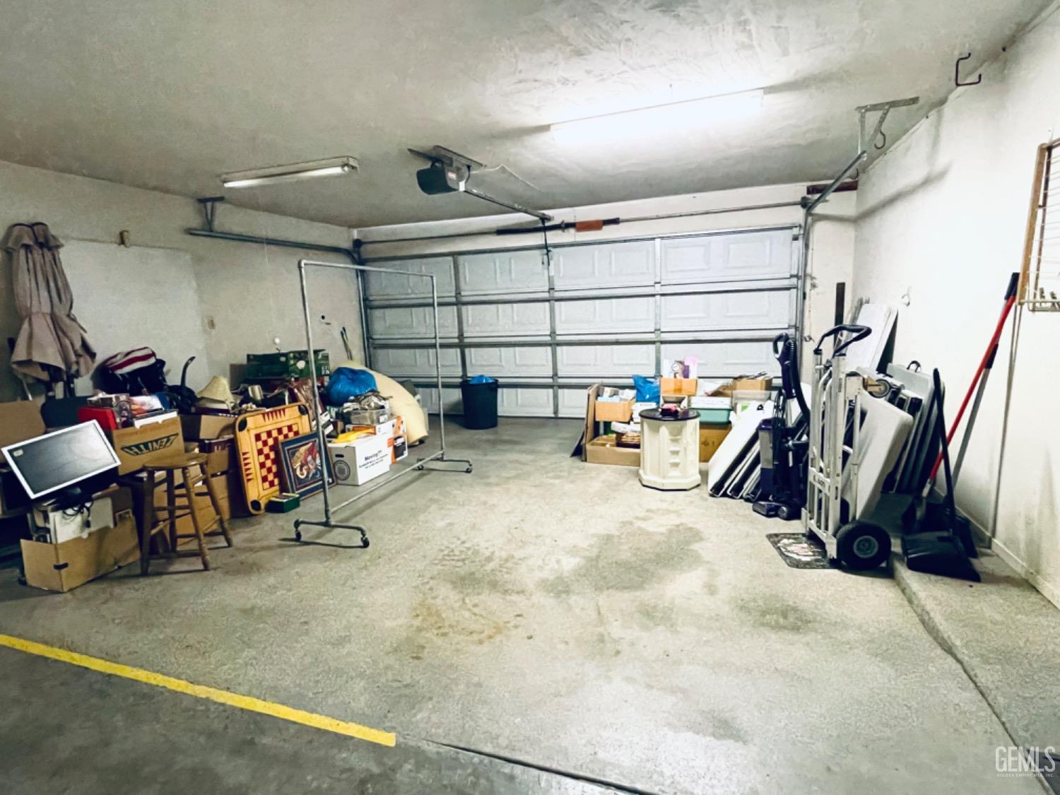 Undisclosed Address Shafter, CA 93263 - Photo 33 of 41 a view of a garage with a bike and car