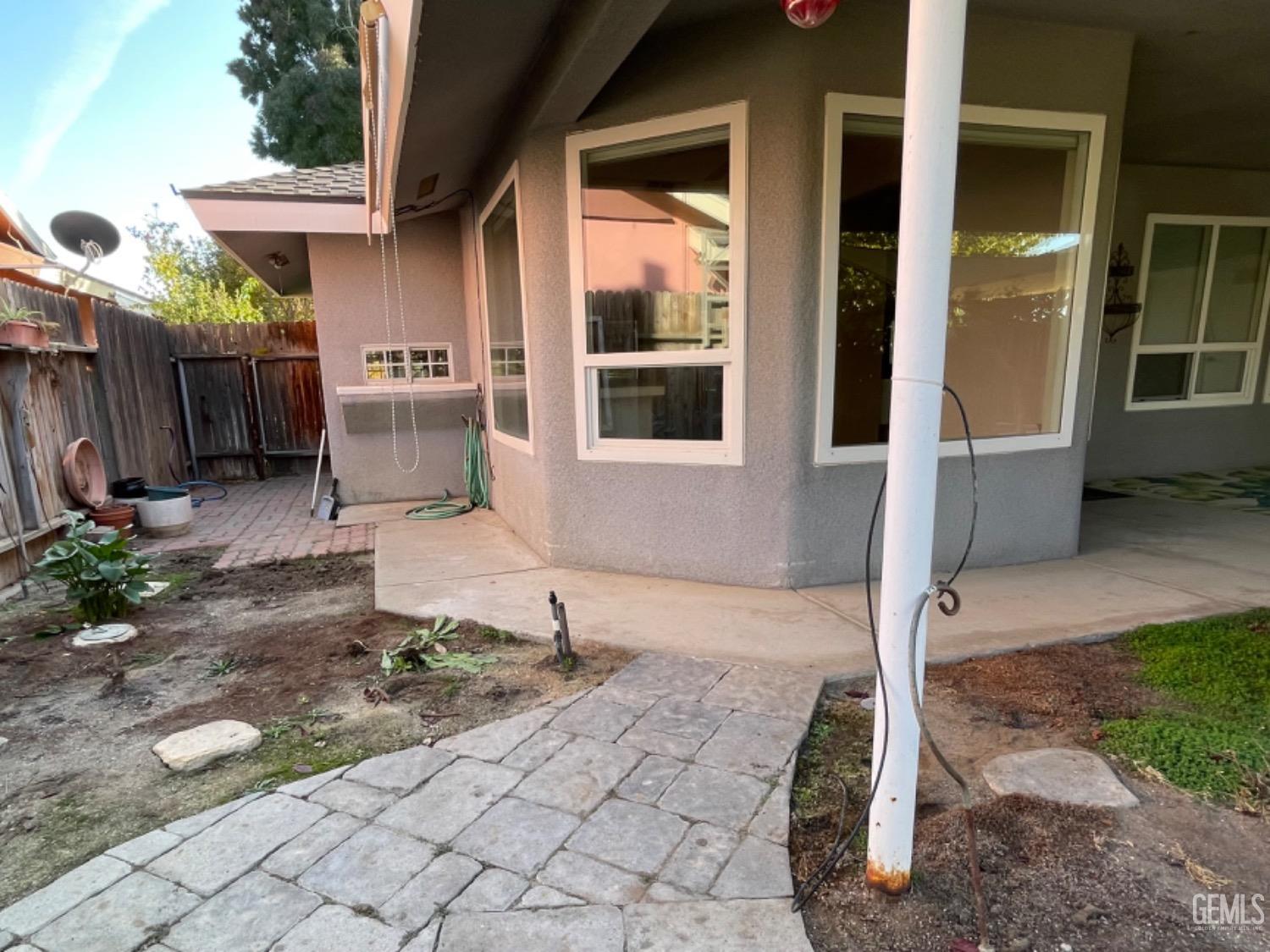 Undisclosed Address Shafter, CA 93263 - Photo 36 of 41 a front view of a house with a yard