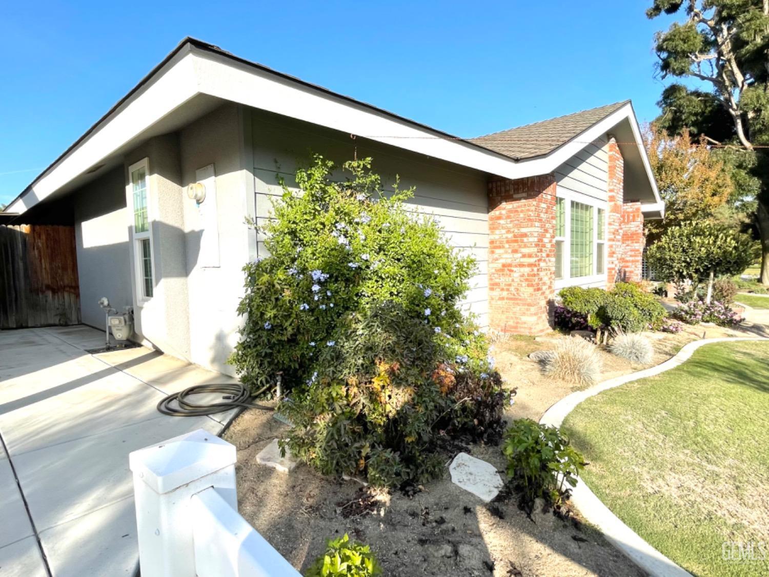 Undisclosed Address Shafter, CA 93263 - Photo 4 of 41 a front view of a house with a yard