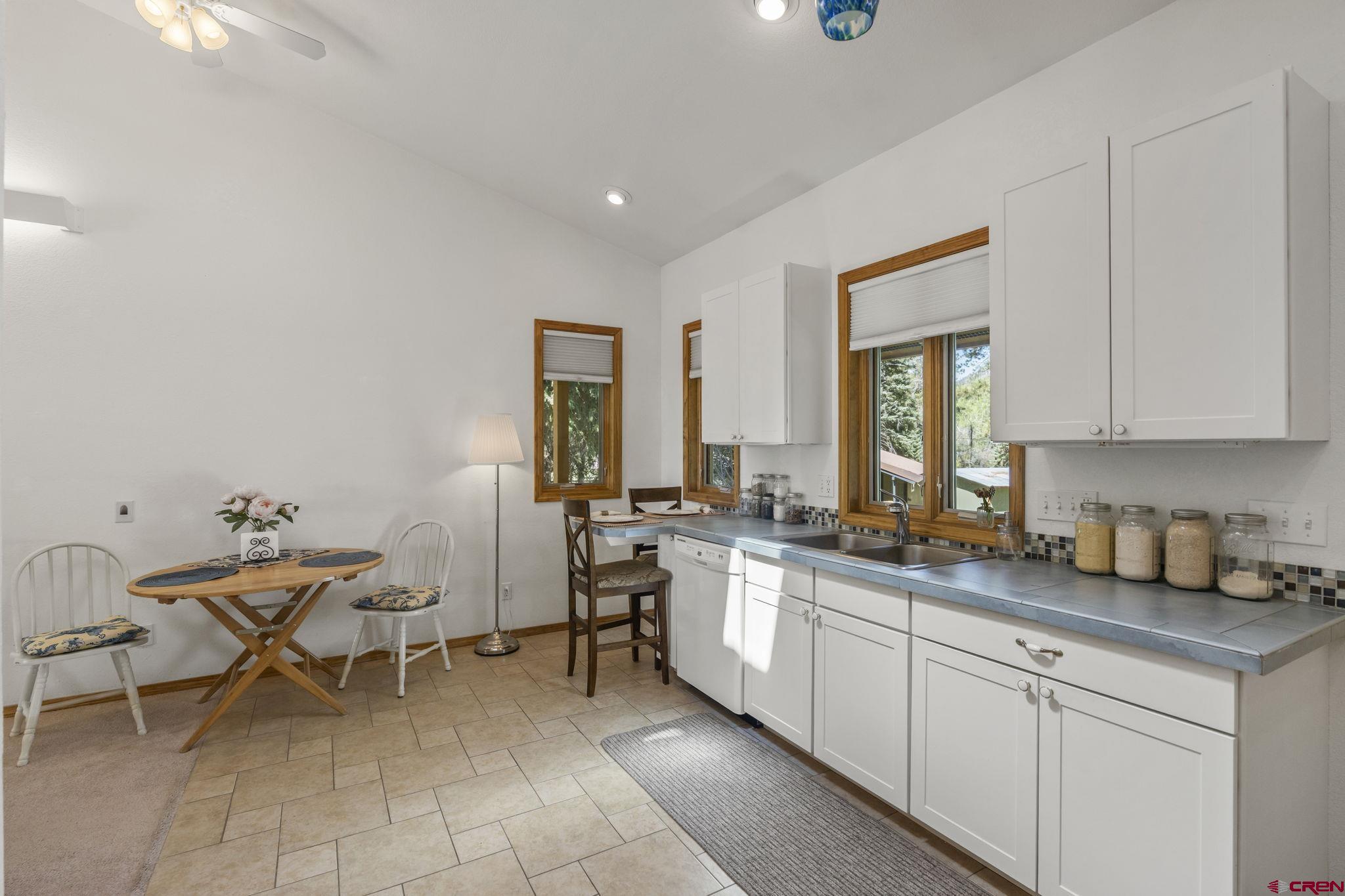 37 Verde Lane Durango, CO 81301 - Photo 35 of 45 a kitchen with a sink and a stove top oven