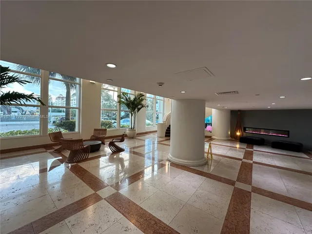 a room with lots of furniture and a rug