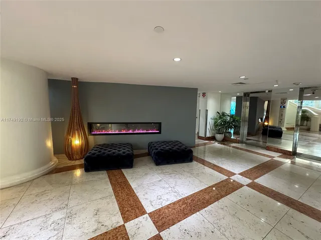 a bedroom with a bed and glass door