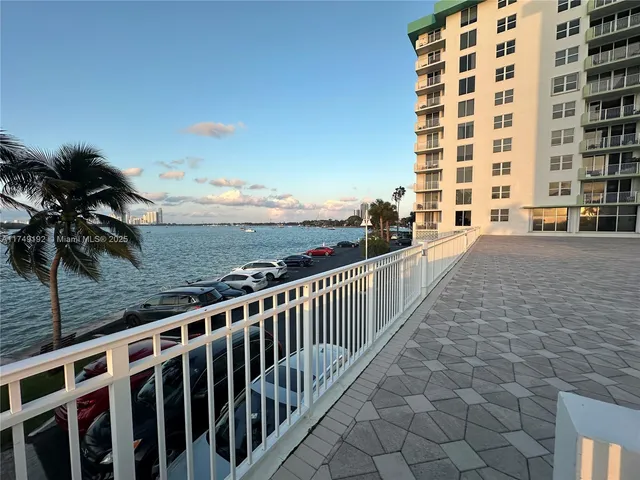 a view of a swimming pool with a patio and a garden