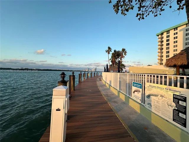 a view of a house with porch and garden