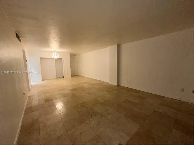 a kitchen with stainless steel appliances granite countertop a refrigerator stove a sink and a microwave