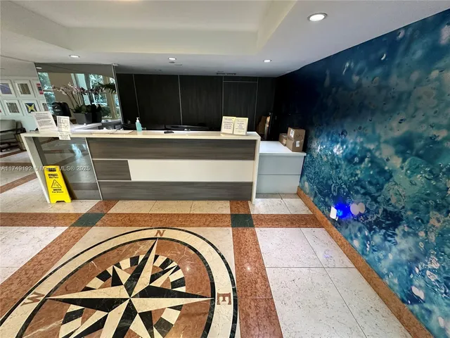 a living room with fireplace furniture and a large window