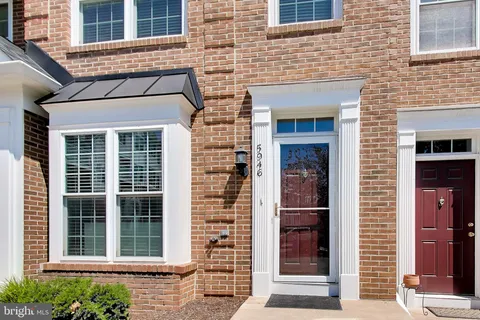 a front view of a building with a window and door