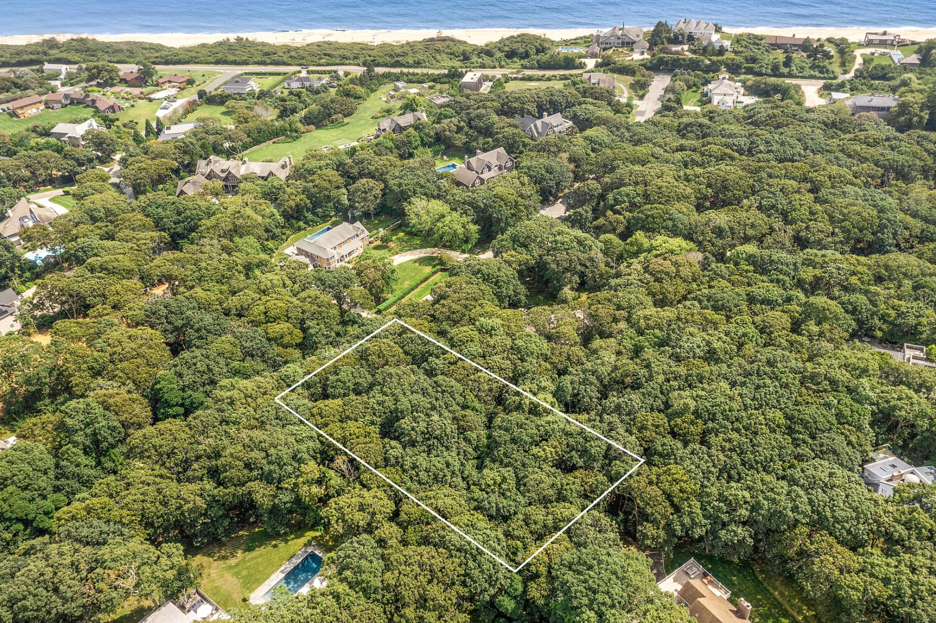 19 Davis Drive Montauk, NY 11954 - Photo 7 of 7 a view of a city with lush green forest