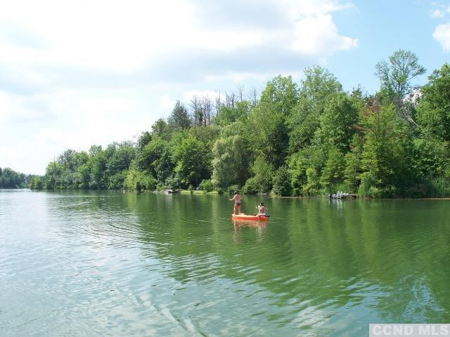 31 Rip Van Winkle Drive Athens, NY 12015 - Photo 6 of 7 a view of a lake with houses in the back