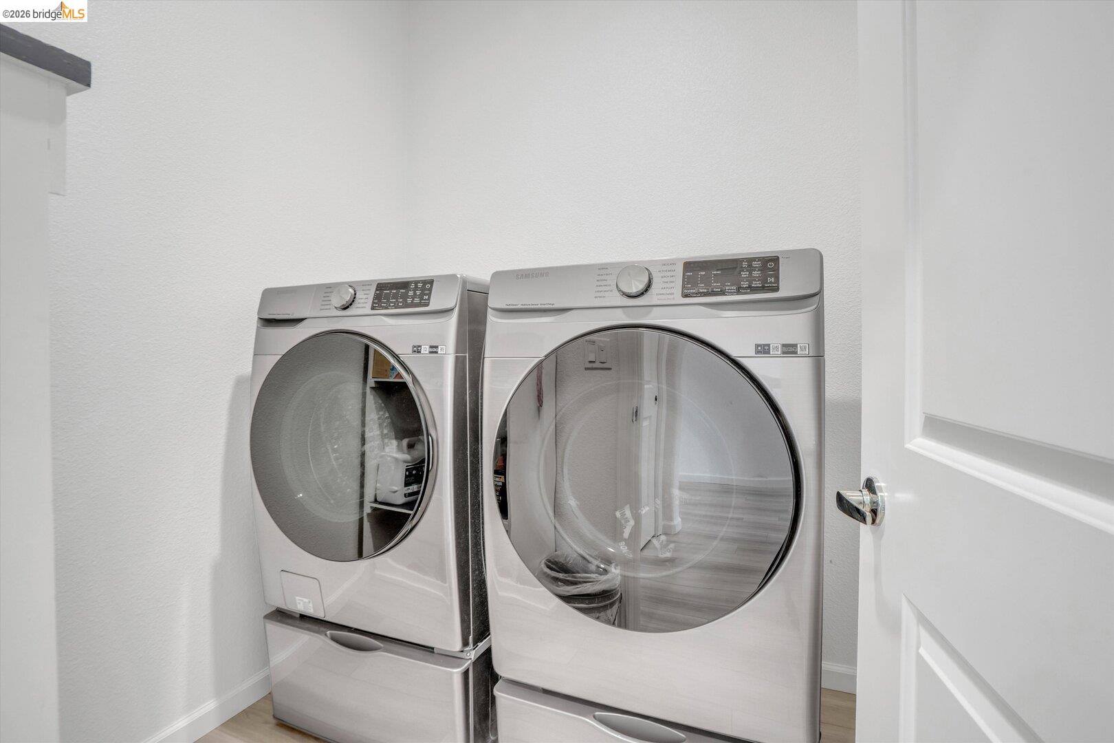 4463 Canada Way Rio Vista, CA 94571 - Photo 9 of 36 laundry area with independent washer and dryer and light wood finished floors
