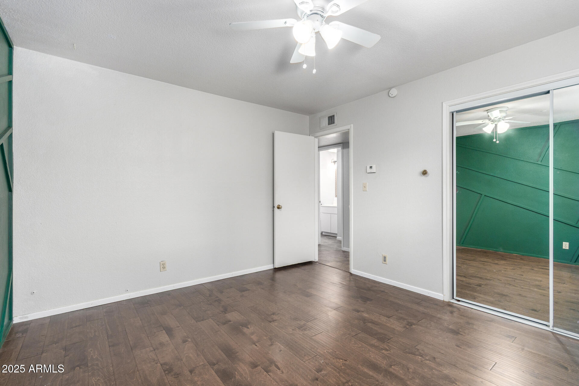 3031 South Rural Road, Unit 45 Tempe, AZ 85282 - Photo 15 of 28 an empty room with closet and windows