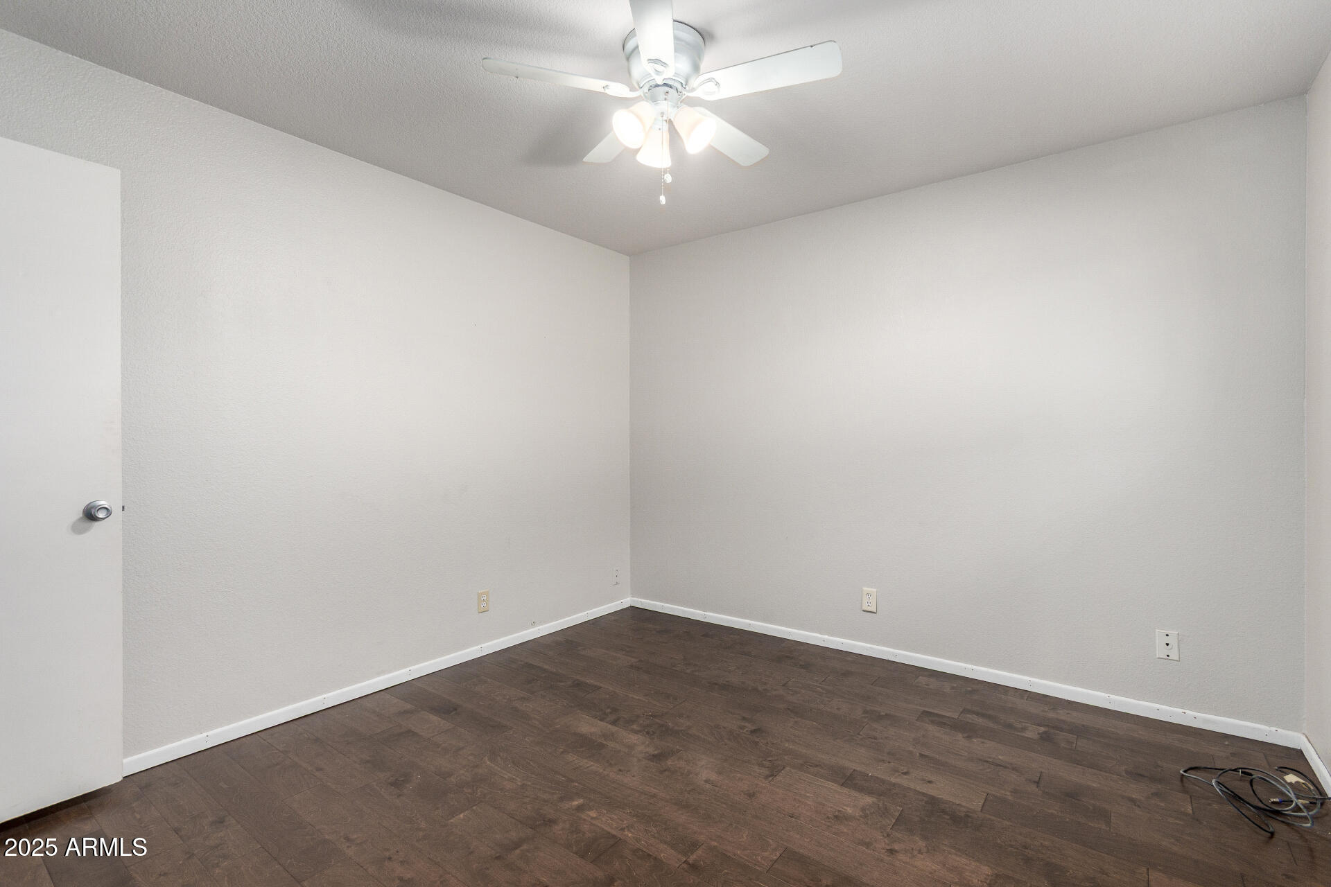 3031 South Rural Road, Unit 45 Tempe, AZ 85282 - Photo 21 of 28 an empty room with a chandelier fan and closet area