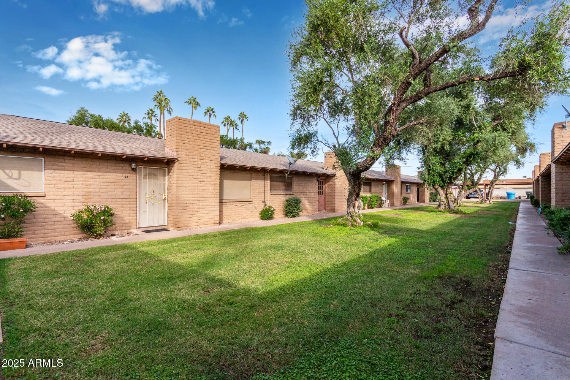 3031 South Rural Road, Unit 45 Tempe, AZ 85282 - Photo 23 of 28 a front view of a house with garden